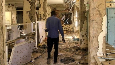 A man walks in the shrapnel-riddled ward of a hospital in Khartoum. AFP