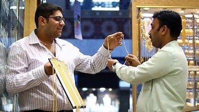 Krish Kumar, left, the business development manager at Kiran Jewellers, will launch his business selling car parts this year. Satish Kumar / The National