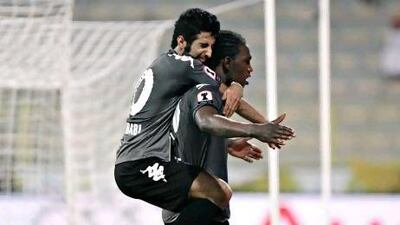 Al Dhafra's Bandar Mohammed, left, and Makhete Diop celebrate the striker's hat-trick. Jeff Topping / The National