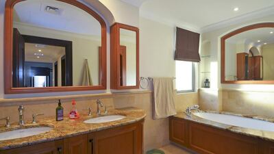 This bathroom has plenty of mirrors to admire your reflection. Courtesy Better Homes