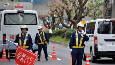 Police officers check a vehicle at a checkpoint near the US embassy in Tokyo on April 22, the day before US President Barack Obama arrives. The US leader will come to Tokyo for a three-day visit from April 23 for the first leg of his Asian tour. Yoshikazu Tsuno / AFP Photo