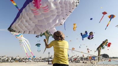 The first day of the Dubai International Kite Festival held on the beach behind Sunset Mall on Jumeirah Beach rd. The festival has participants from over 25 countries. Peter Lynn from New Zealand steadies his giant Manta Ray kite. Antonie Robertson / The National
