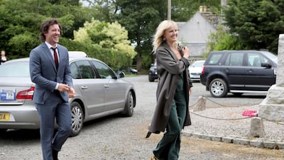 Actor Jack Donnelly arrives with partner Malin Akerman for the wedding ceremony of Game Of Thrones actors Kit Harington and Rose Leslie. Jane Barlow / PA via AP