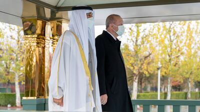 Sheikh Mohamed and Mr Erdogan stand as the two countries' national anthems are played at the Presidential Complex. Mohamed Al Hammadi / Ministry of Presidential Affairs
