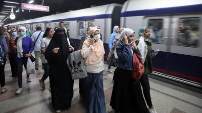 Passengers at Sadat metro station, Cairo, Egypt. The country has recently stepped up measures to control the spread of Covid-19. EPA