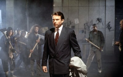 As John Trent, Neill portrays a sceptical investigator drawn into a collapsing reality. Photo: New Line Cinema