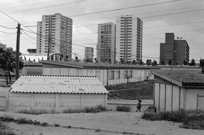 The housing estate, above in the background, where the Sedira family lived in the neglected Parisian suburb of Gennevilliers. Getty Images