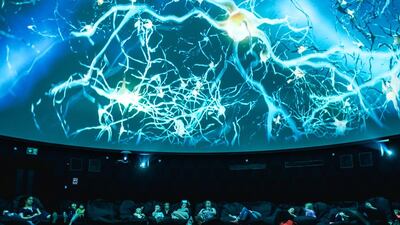 Children and parents watch an animated movie about space exploration at the Dome Cinema in Dubai Boxpark. Blossom Nurseriesorganised the event to offer career advice to children’s early ambitions. Alex Atack for The National