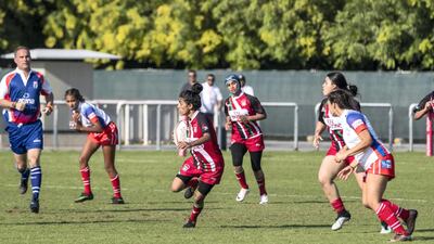 An Al Maha School girls player tries to make a break.