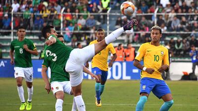 Bolivia's Gabriel Valverde attempts to control the ball ahead of Neymar. Nelson Almeida / AFP