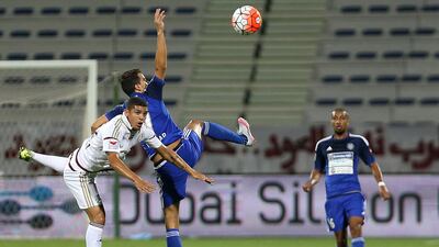 Nilmar ( no 7 in blue ) of Al Nasr and Denilson of Al Wahda in action during the Arabian Gulf League match. Pawan Singh / The National