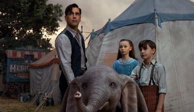 Colin Farrell, Nico Parker and Finley Hobbins in a scene from 'Dumbo'. Disney via AP