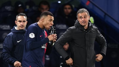Paris Saint-Germain's head coach Luis Enrique, right, has guided his team to the top of Ligue 1 having turned down Napoli in the summer. AFP