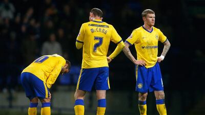 Shaun Maloney, left, Chris McCann and James McClean of Wigan react after going a goal behind during their FA Cup match against Bolton Wanderers at the Macron Stadium on January 3, 2015 in Bolton, England. Paul Thomas/Getty Images