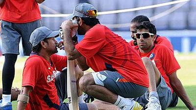 Dhoni and Tendulkar have a chat and discuss strategy during a break in the practice session.