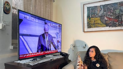 Lina Abu Akleh, niece of killed Palestinian American journalist Shireen Abu Akleh, watches US President Joe Biden speak after his arrival at Tel Aviv's Ben Gurion International Airport. AFP