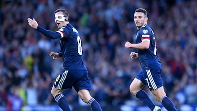 Scotland's Callum McGregor celebrates pulling a goal back to make it 2-1. PA