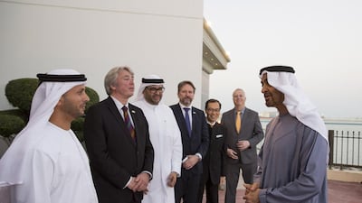 Sheikh Mohammed bin Zayed, Crown Prince of Abu Dhabi and Deputy Supreme Commander of the Armed Forces, speaks with Angelino Alfano, Minister of Foreign Affairs and International Cooperation of Italy (2nd R), Dr Anwar Gargash, Minister of State for Foreign Affairs and Liborio Stellino, Ambassador of Italy to the UAE (L), during a Sea Palace barza. Hamad Al Kaabi / Crown Prince Court — Abu Dhabi