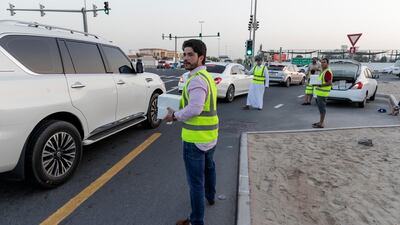Iftar meals being distributed to motorists in Al Quoz 1, Dubai. Antonie Robertson / The National