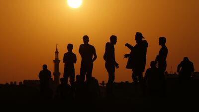 Palestinian protesters gather during clashes with Israeli troops following a demonstration along the border fence east of Khan Yunis in the southern Gaza Strip. AFP