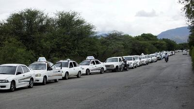 Motorists queue at a petrol station of the Venezuelan oil company PDVSA. The country is in crisis. Reuters