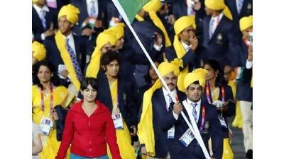 India's flag bearer Sushil Kumar with the woman in red Mike Blake / Reuters