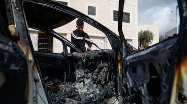 A burnt-out car after an Israeli settler attack in Al Mughayyir, near Ramallah. Reuters
