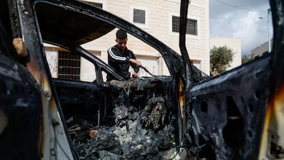 A burnt-out car after an Israeli settler attack in Al Mughayyir, near Ramallah. Reuters