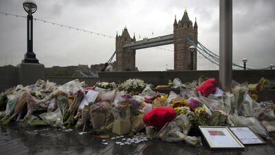 Flowers and tributes left outside City Hall, near Tower Bridge for victims of the London Bridge terror attacks in Central London. EPA/WILL OLIVER