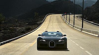 The Grand Sport 16.4, Bugatti's convertible, is a car that will have you running out of superlatives long before you tire of driving it.