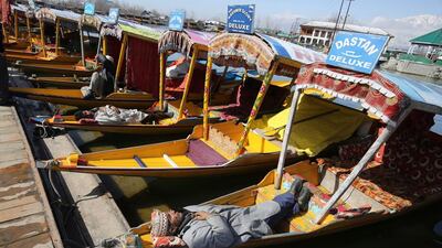 Kashmiri Boatmen take nap on sunny day at Dal Lake in Srinagar, the summer capital of Indian Kashmir. Farooq Khan / EPA