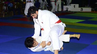 UAE's Yahia Mansour Al Hammadi, top, has Japan’s Masamoto Nishibayashi pinned down. Photo courtesy UAE Jiu-Jitsu Federation