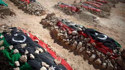The graves of Libyan rebels killed during fighting with Muammar Gaddafi's government forces line a hillside in a cemetery in Nalut in Libya's Western Mountains in this August 3, 2011 file photo. REUTERS/Bob Strong