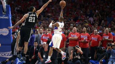 Chris Paul of the Los Angeles Clippers shoots the winning basket over Tim Duncan on Saturday in Game 7 of their first round NBA play-offs series. Michael Nelson / EPA / May 2, 2015