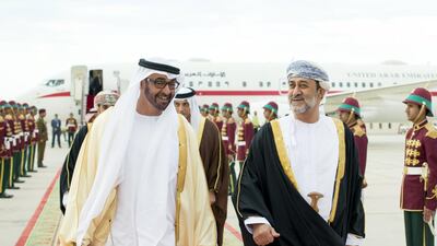 Sheikh Mohammed bin Zayed is received by Oman's Minister of Heritage and Culture, Sayyid Haitham bin Tariq Al Said, right, upon arriving in Muscat for an official visit. Ryan Carter / Crown Prince Court — Abu Dhabi