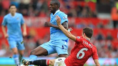 Yaya Toure, above centre, and his brother, Kolo, wil not be a part of Roberto Mancini's Manchester City side this time around due to obligations to their country's FA. And Jonny Evans is among Sir Alex Ferguson's long injured list at United.