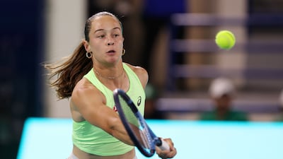 Zeynep Sonmez volleys at the net.