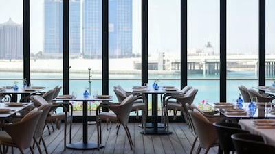 Floor-to-ceiling windows ensure great views no matter where you're seated. Khushnum Bhandari / The National