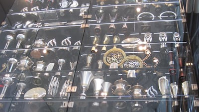 The trophies in the main trophy cabinet in the reception area of the headquarters. Photo: Daniel Bardsley for The National