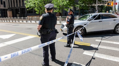 Police join investigators from agencies including the FBI at 26 Federal Plaza after an incendiary device went off outside the building housing ICE offices, in New York City. AFP