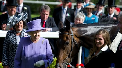 Queen Elizabeth II with her horse Estimate after winning the Queen's Vase during Royal Ascot in 2012. Getty