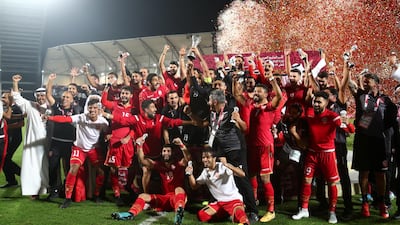 Bahrain players and staff celebrate their Gulf Cup of Nations triumph. Reuters