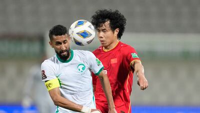 China's Junmin Hao and Saudi Arabia's Salman Alfaraj battle. AP