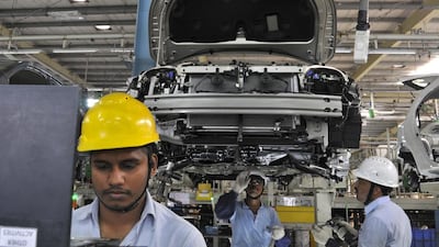 Above, workers at the assembly line of Toyota Etios cars in Bidadi, on the outskirts of Bengaluru. Abhishek N Chinnappa / Reuters
