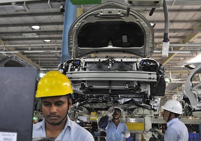Workers at the assembly line of Toyota Etios cars in Bidadi, on the outskirts of Bengaluru. Reuters