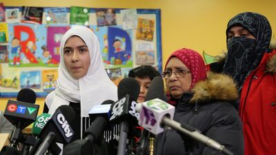 Khawlah Noman, 11, speaks to reporters with her mother at the Pauline Johnson Junior Public School in Toronto on January 12, 2018. Chris Helgren / Reuters