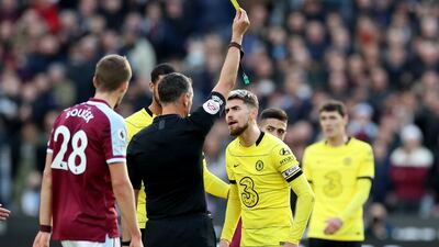 Chelsea's Jorginho is shown a yellow card by referee Andre Marriner. Reuters