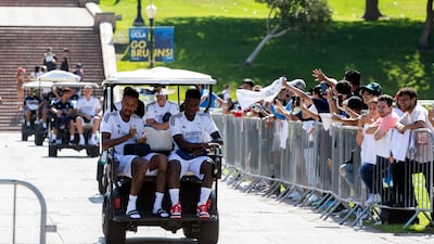 Supporters cheer as Real Madrid squad arrives to train at the UCLA Wallis Annenberg Stadium in Los Angeles. EPA