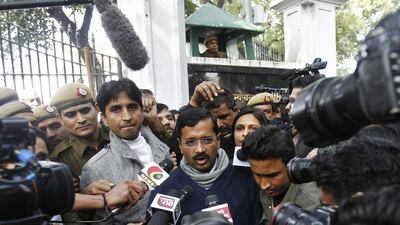 Arvind Kejriwal (centre), leader of the newly formed Aam Aadmi (Common Man’s) party, after meeting with Delhi's lieutenant governor Najeeb Jung and striking a deal to become Delhi’s chief minister. Anindito Mukherjee / Reuters