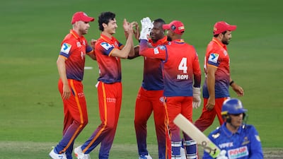 Dubai Capitals pacer Farhan Khan, second left, bowled a superb last over to grab a one-run win over MI Emirates during the opening match of the DP World International League T20 in Dubai on Saturday, January 11, 2024. All images: CREIMAS / ILT20